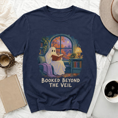 Navy t-shirt with ghost reading by a window and "Booked Beyond The Veil" text.