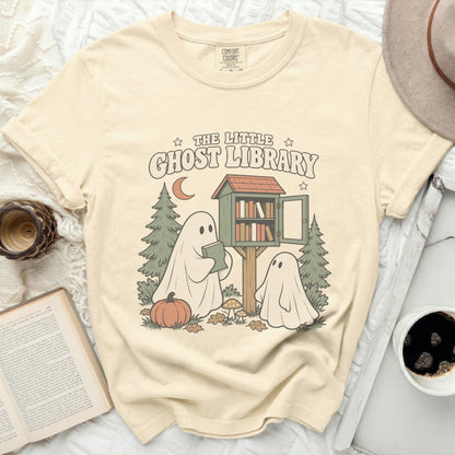The Little Ghost Library graphic on a cream Comfort Colors t-shirt.