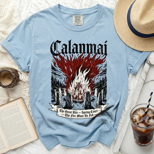 Light blue t-shirt with "Calanmai" and a bonfire graphic, "The Great Rite – Spring Court – The Fire Must Be Fed".