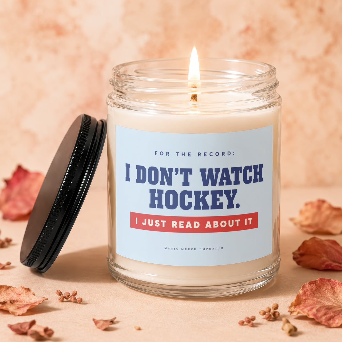 Candle with label "I DON'T WATCH HOCKEY. I JUST READ ABOUT IT."
