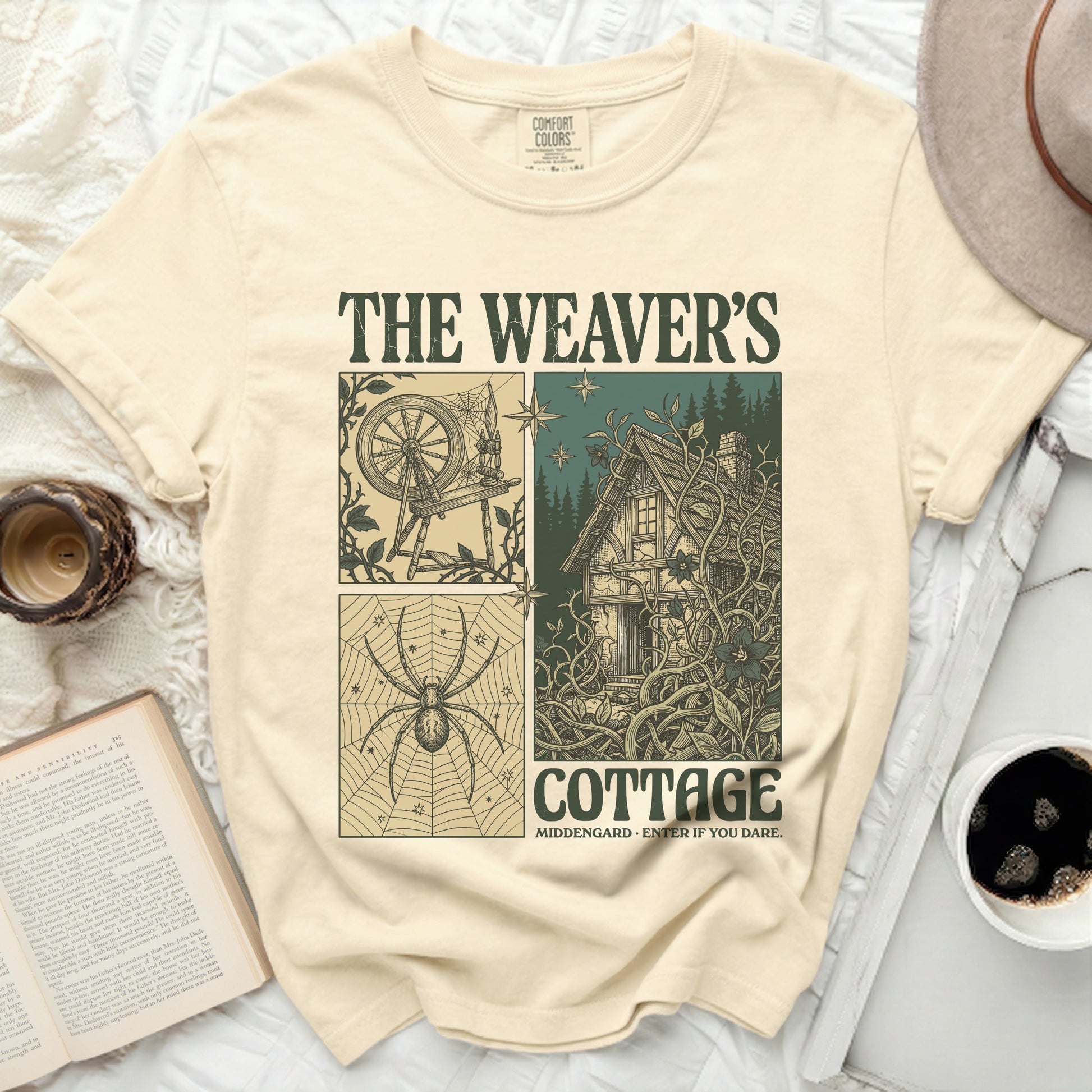 The Weaver's Cottage t-shirt features a four-panel design with a spinning wheel, spider, cottage, and text.