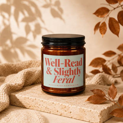Amber jar candle with black lid labeled "Well-Read & Slightly Feral".