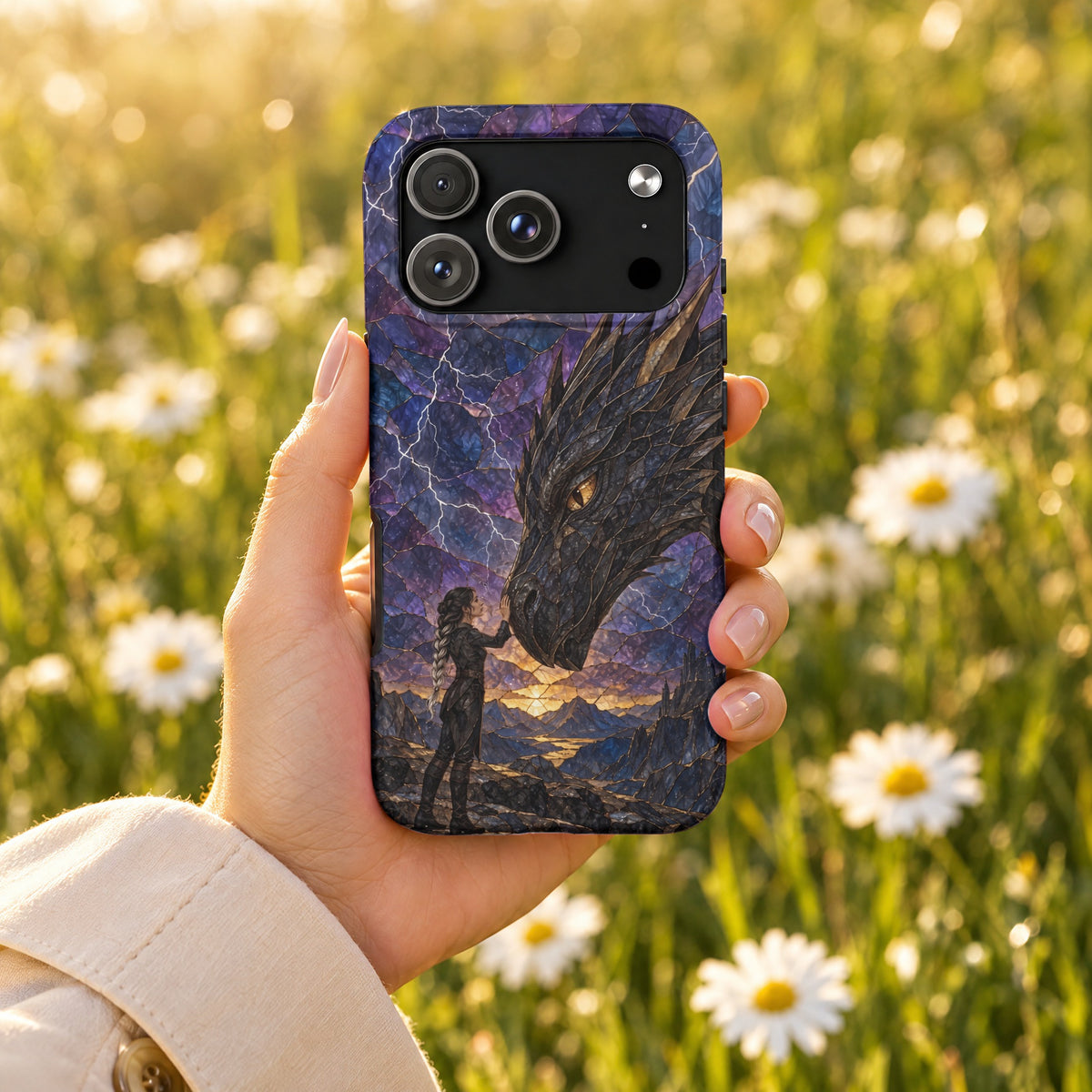 A hand holding a smartphone with a mosaic-style case depicting a woman touching a dragon.