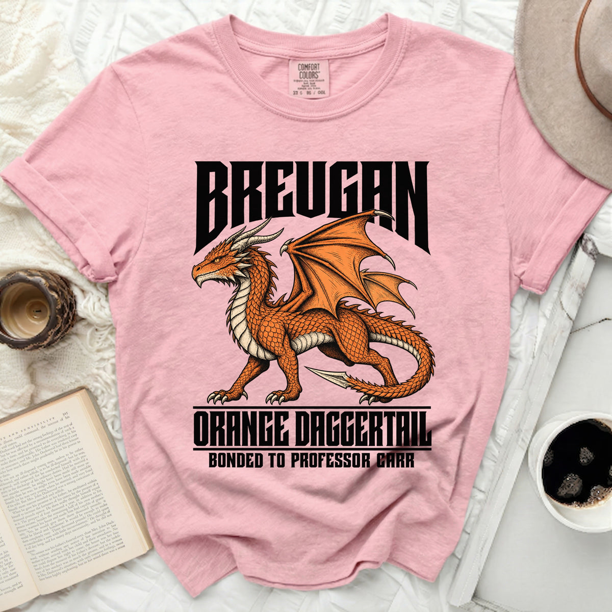 Pink t-shirt with a dragon graphic and text "Breugan Orange Daggertail Bonded to Professor Carr".