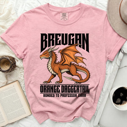 Pink t-shirt with a dragon graphic and text "Breugan Orange Daggertail Bonded to Professor Carr".