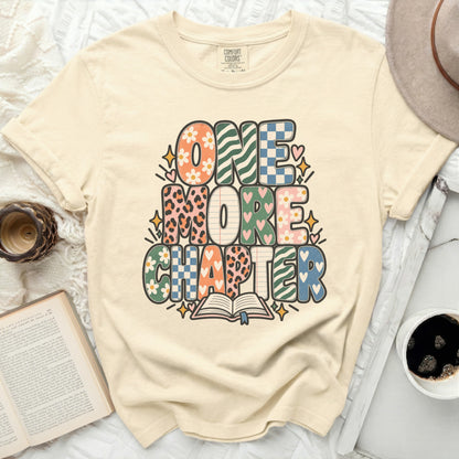 Comfort Colors t-shirt with "ONE MORE CHAPTER" graphic and open book.