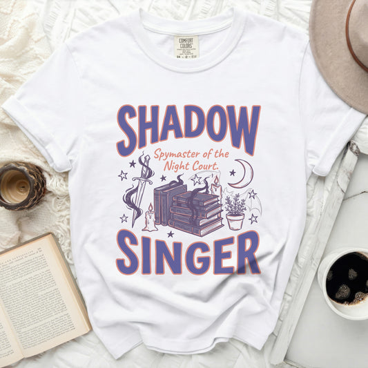 White t-shirt with "SHADOW Spymaster of the Night Court. SINGER" graphic.