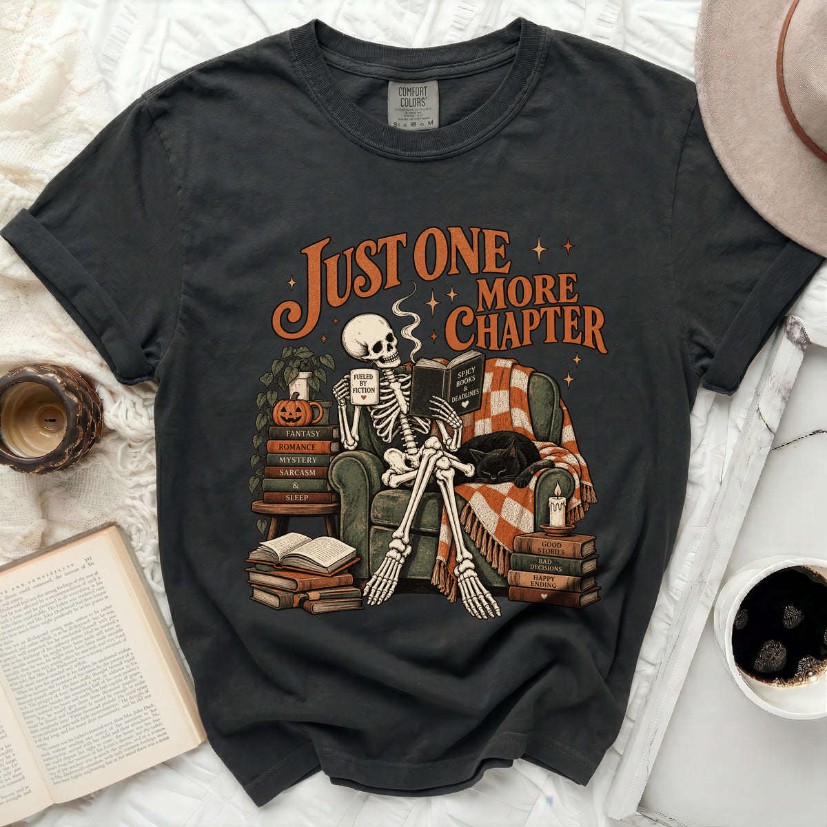 Skeleton reading "Spicy Books & Deadlines" under "Just One More Chapter" text.