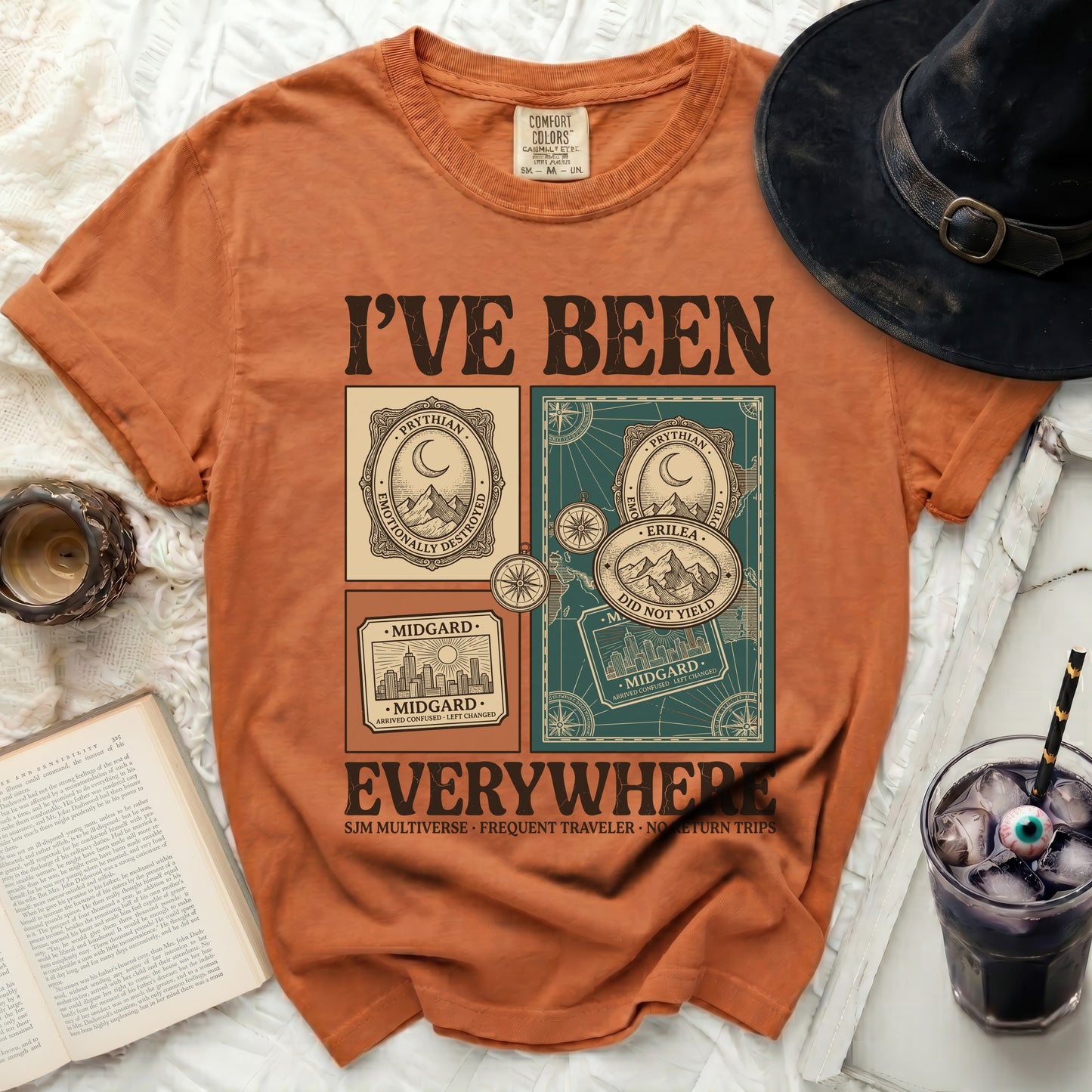 Orange t-shirt with "I'VE BEEN EVERYWHERE" graphic and travel motifs.