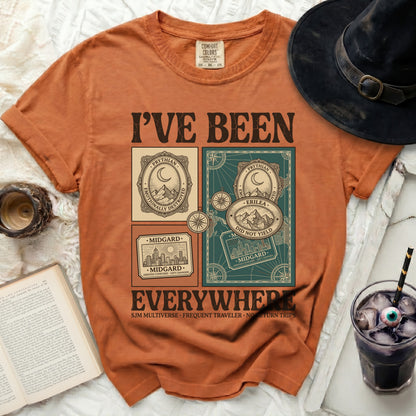 Orange t-shirt with "I'VE BEEN EVERYWHERE" graphic and travel motifs.