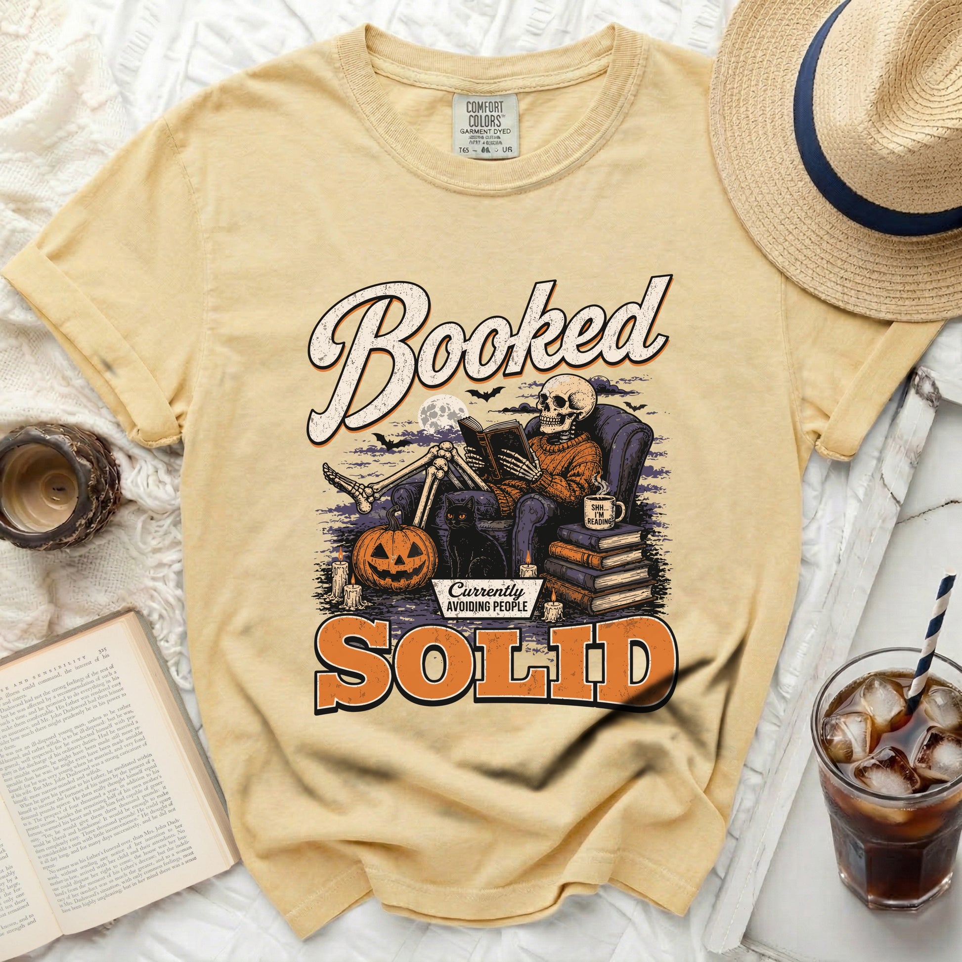 Yellow t-shirt with skeleton reading, "Booked," and "Currently Avoiding People" text.