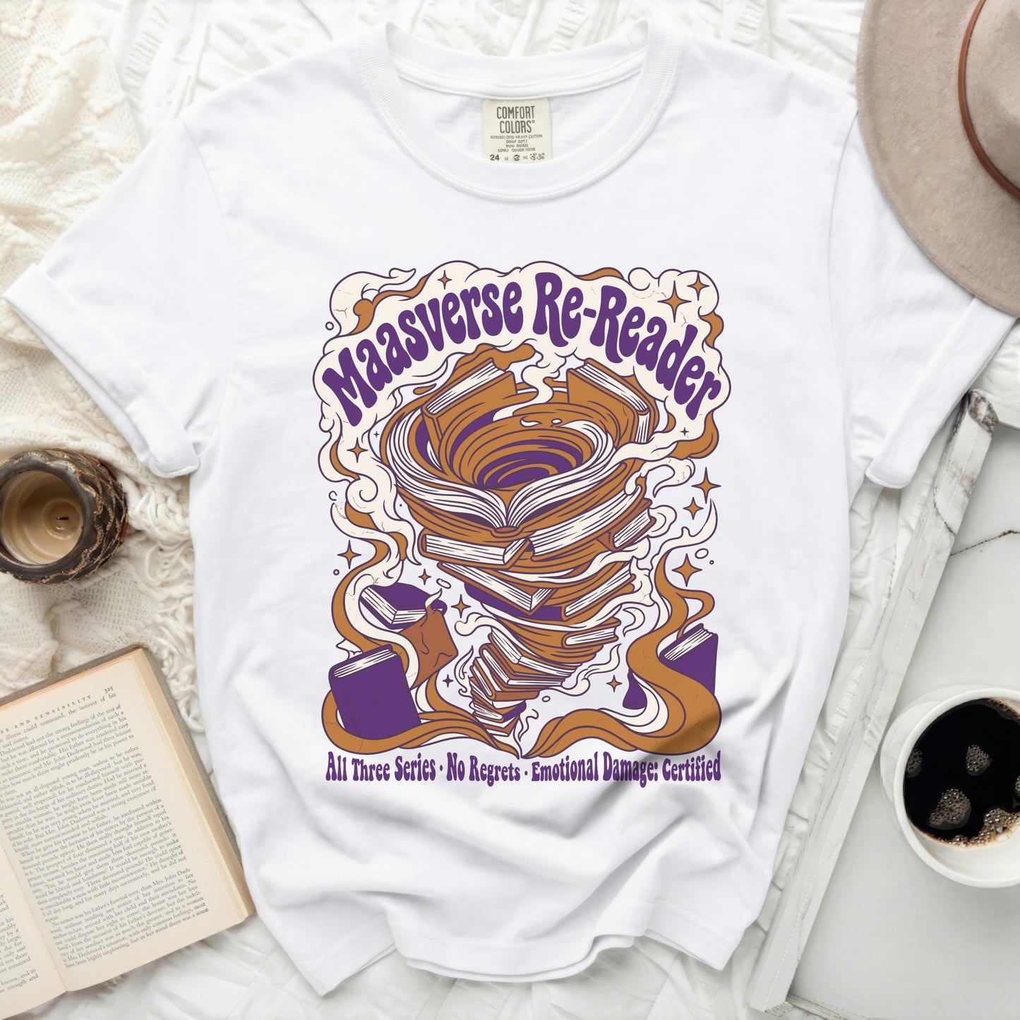 White t-shirt with "Maasverse Re-Reader" and swirling books graphic.