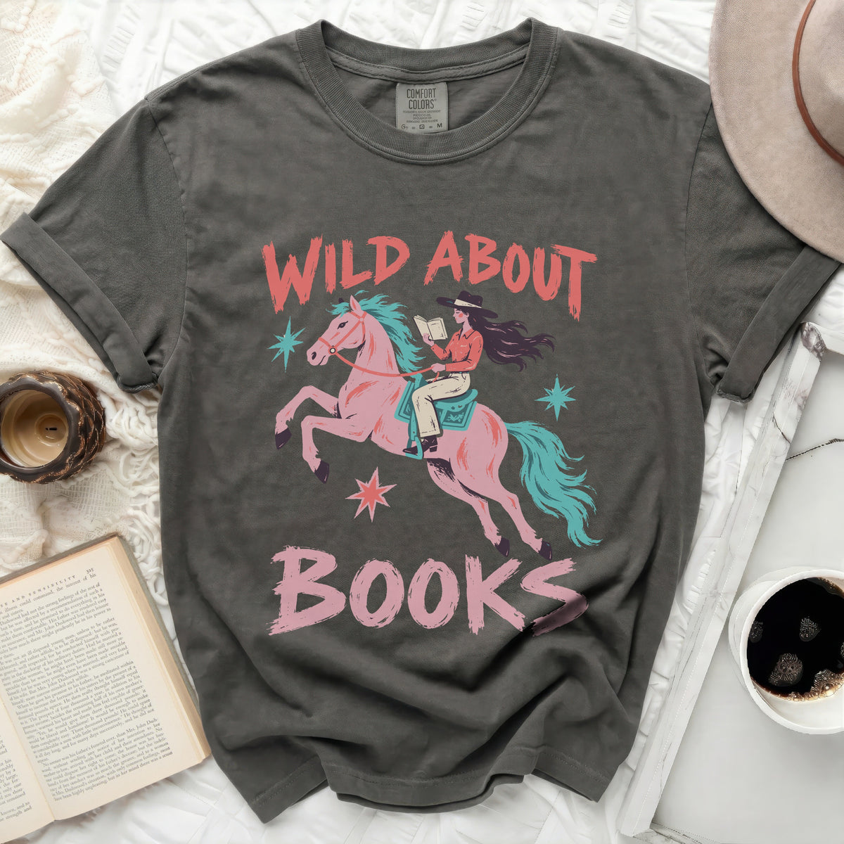 T-shirt with "Wild About Books" graphic featuring a woman riding a pink horse.