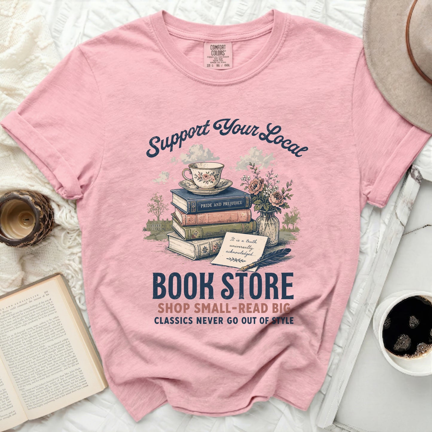 Pink t-shirt with graphic: "Support Your Local BOOK STORE".