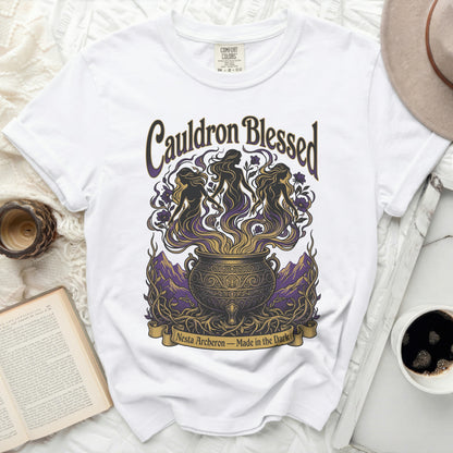White t-shirt with "Cauldron Blessed Nesta Archeron - Made in the Dark" graphic.
