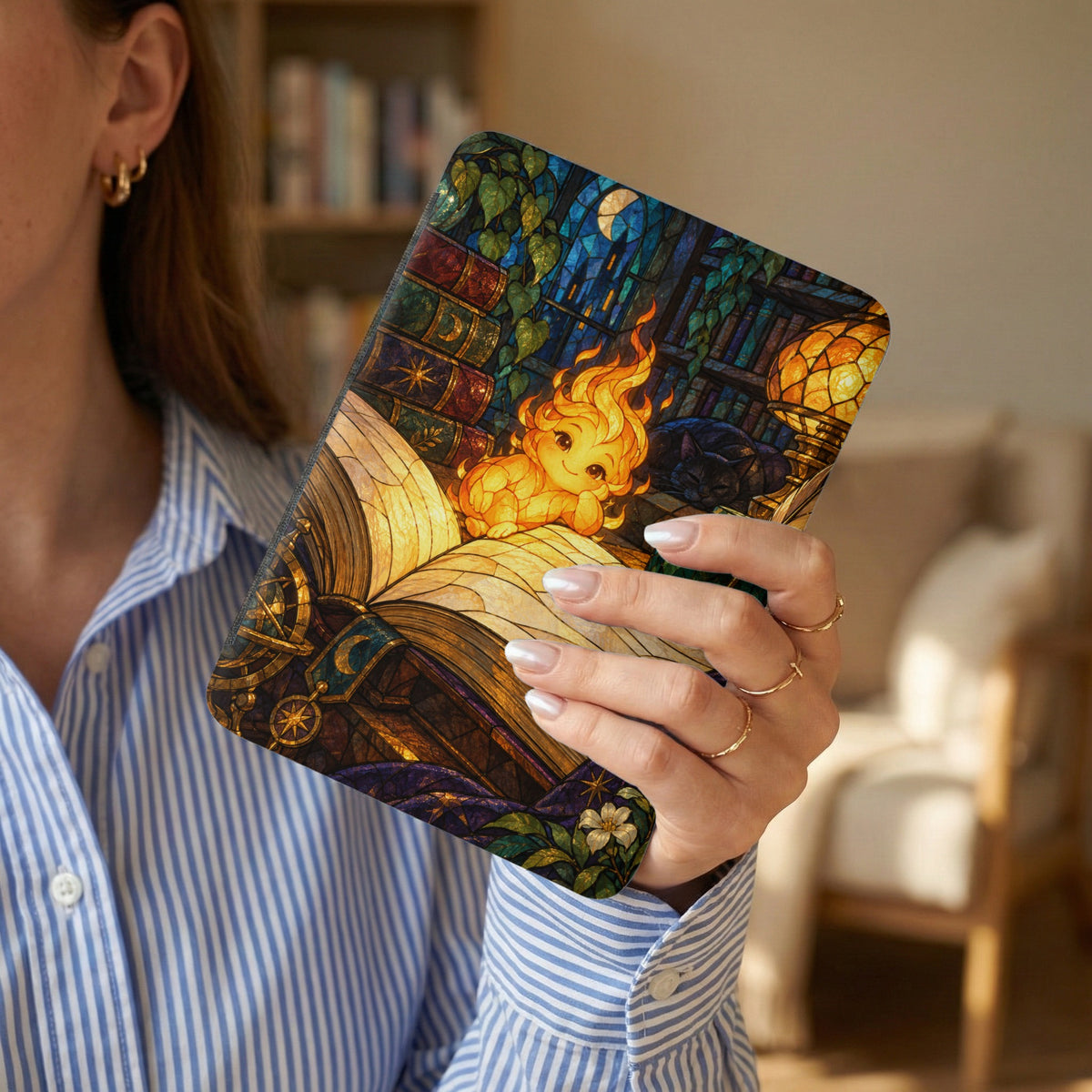 Stained glass case with fire creature, cat, and books design.