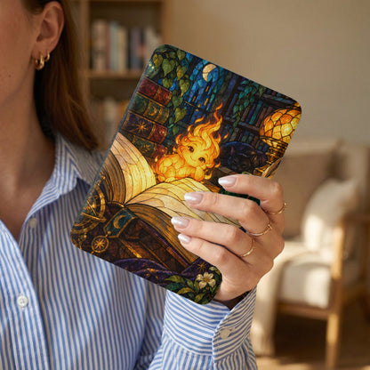 Stained glass case with fire creature, cat, and books design.