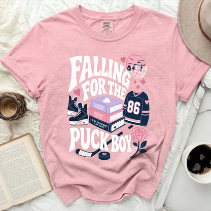 Pink t-shirt with "Falling for the Puck Boy" text and hockey graphics.