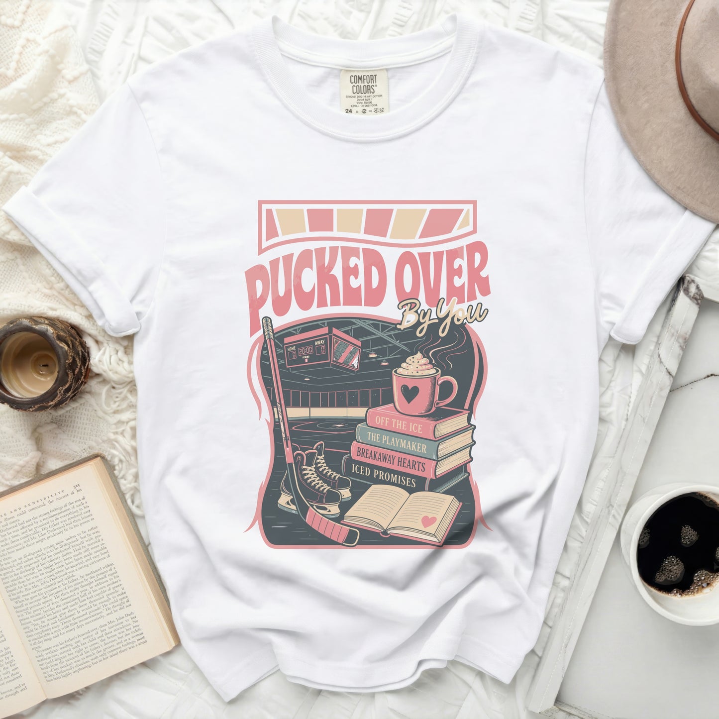 White t-shirt with "Pucked Over By You" hockey-themed graphic.