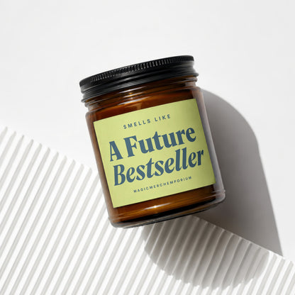 Brown candle in jar with label that reads "Smells Like A Future Bestseller".