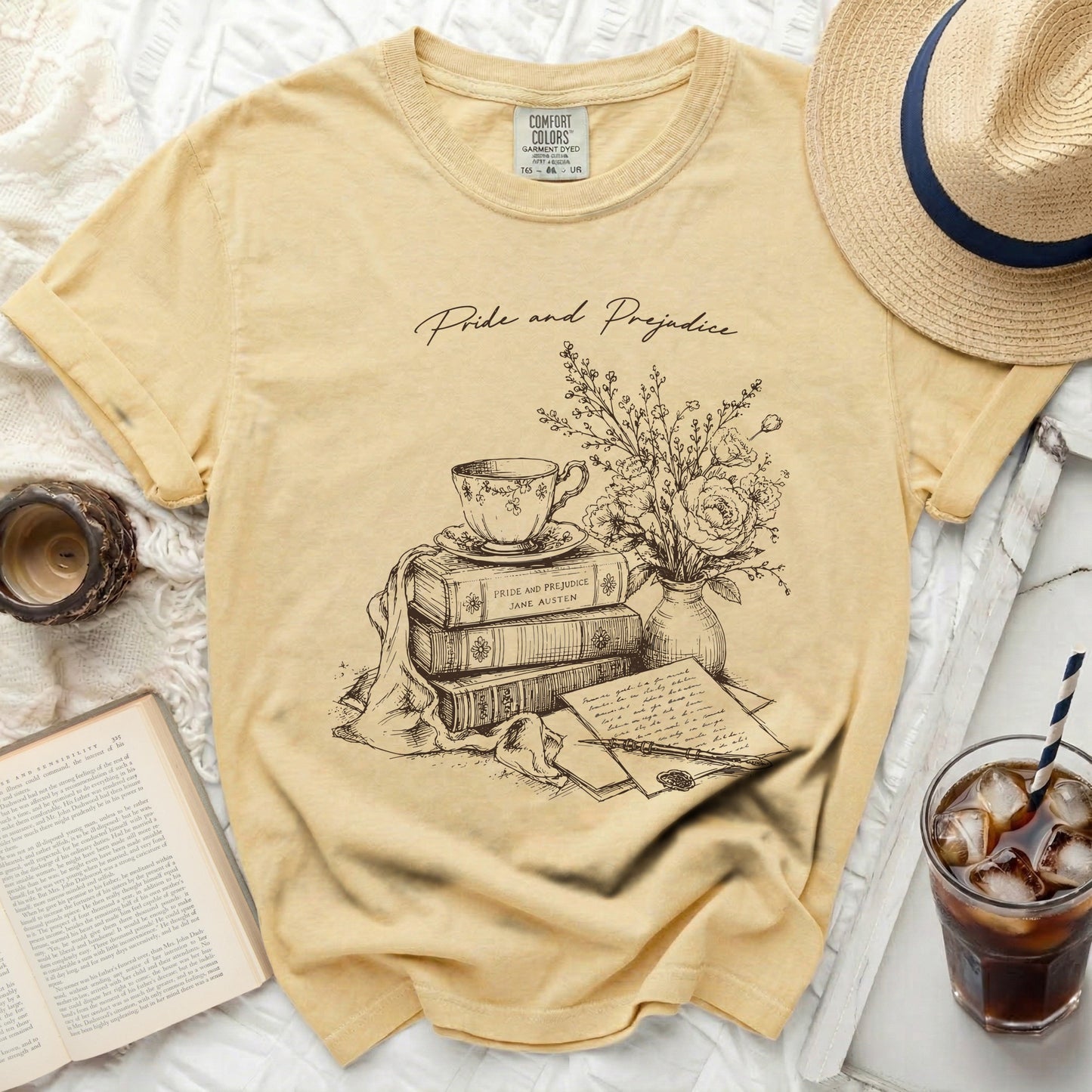 Yellow t-shirt with 'Pride and Prejudice' book sketch and text.