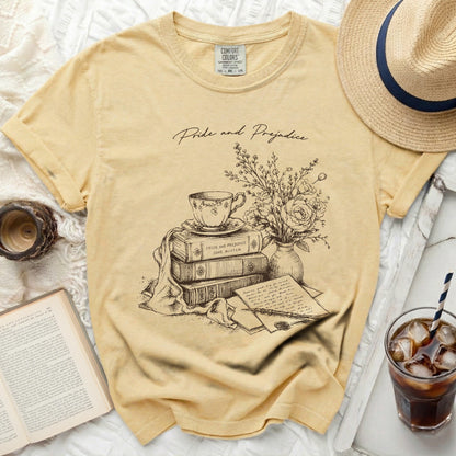 Yellow t-shirt with 'Pride and Prejudice' book sketch and text.