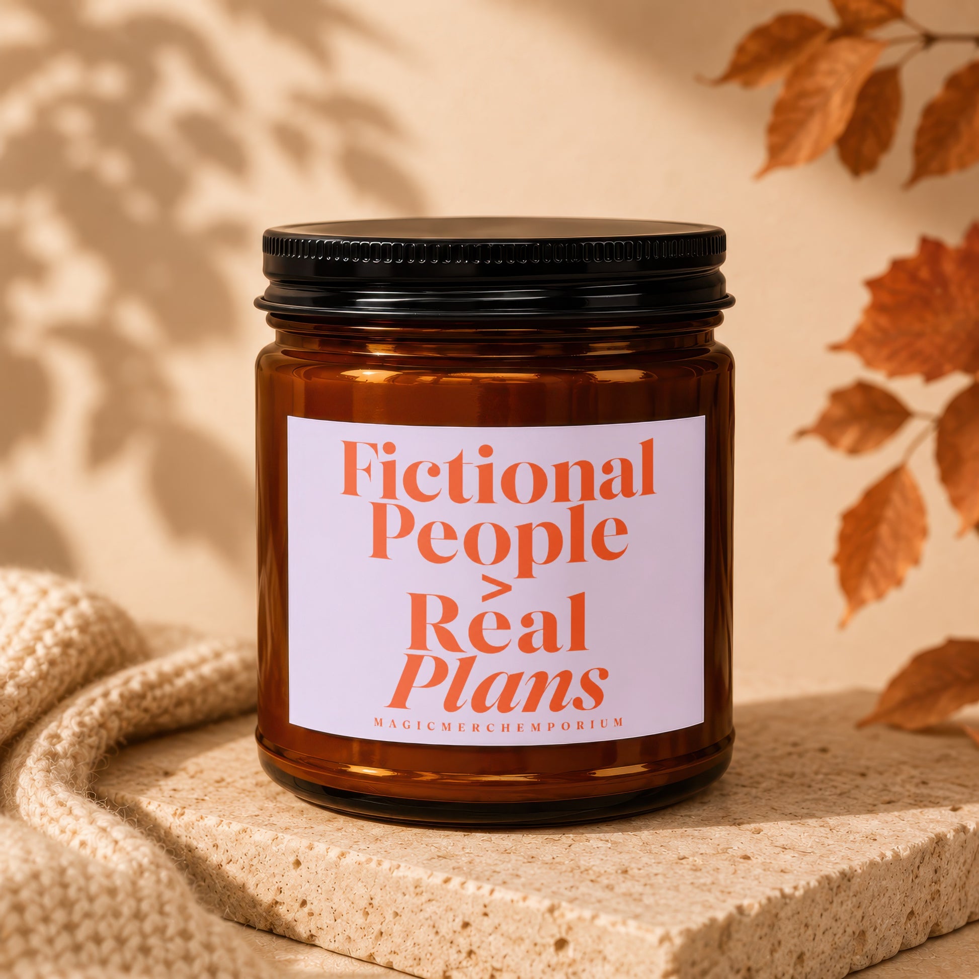 Amber jar candle with a white label displaying "Fictional People > Real Plans."