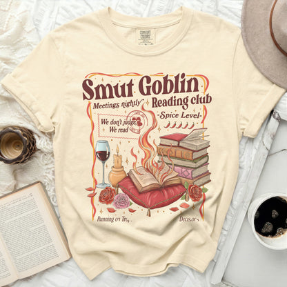 Cream t-shirt with "Smut Goblin Reading club" graphic and a wine glass.