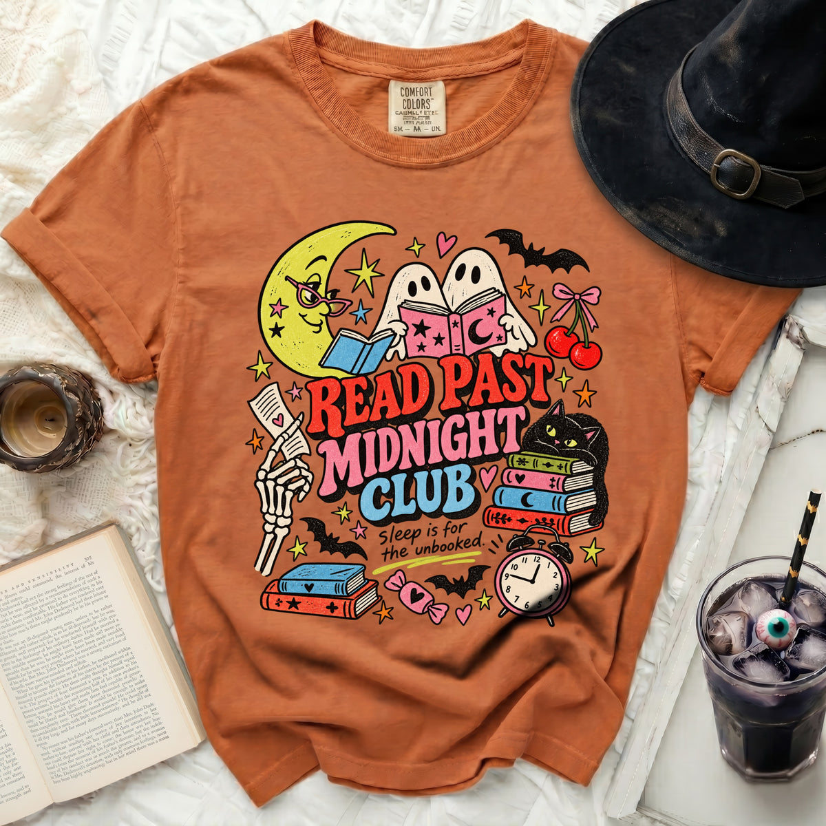 Orange t-shirt with "Read Past Midnight Club" and Halloween graphics.