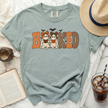 Light blue t-shirt with "BAKED" Halloween ghost design and bats.