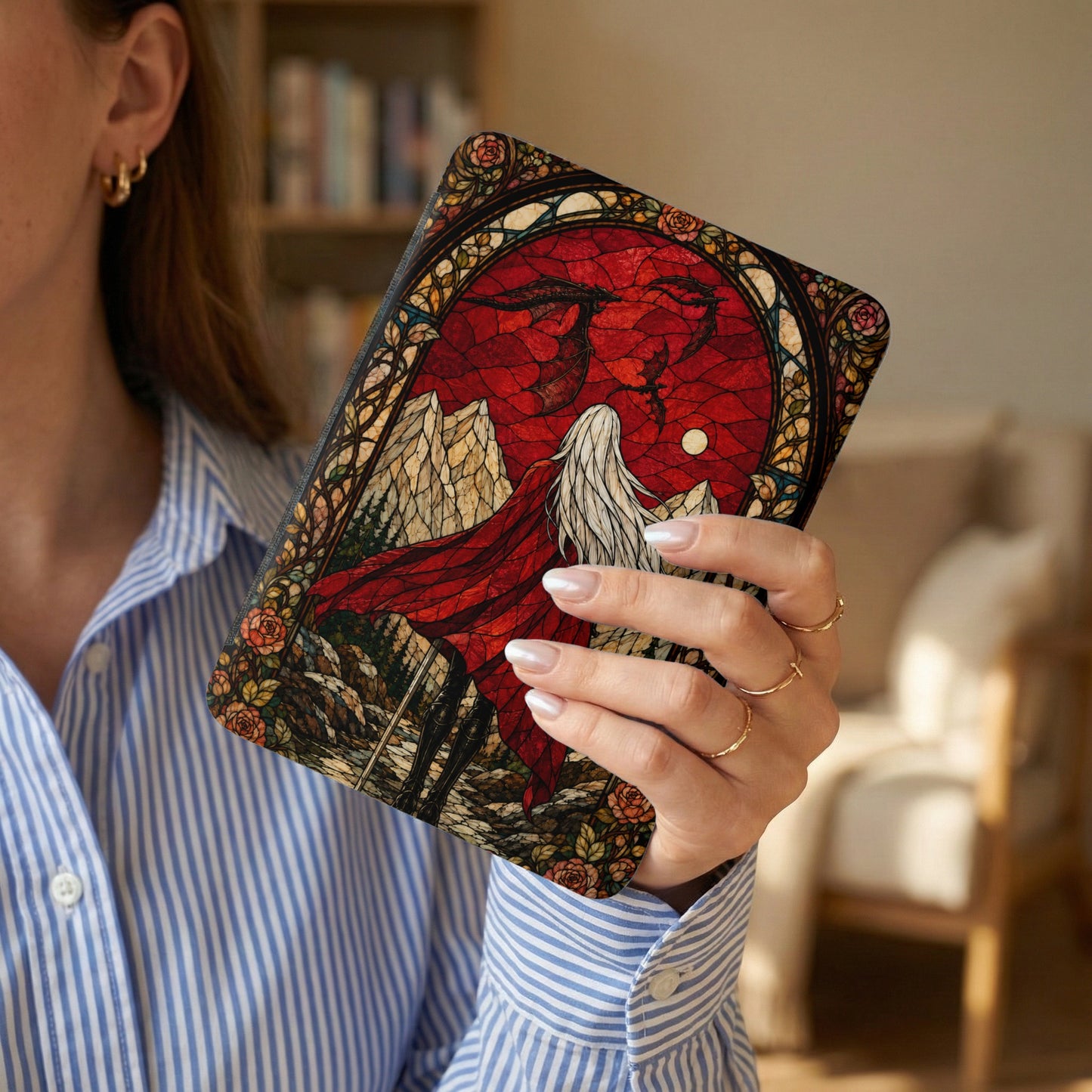 Book cover with stained glass art of a winged figure and mountains.