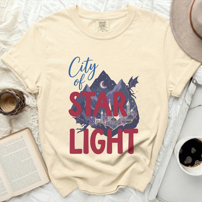 Cream t-shirt with "City of Star Light" text and fantasy scene.