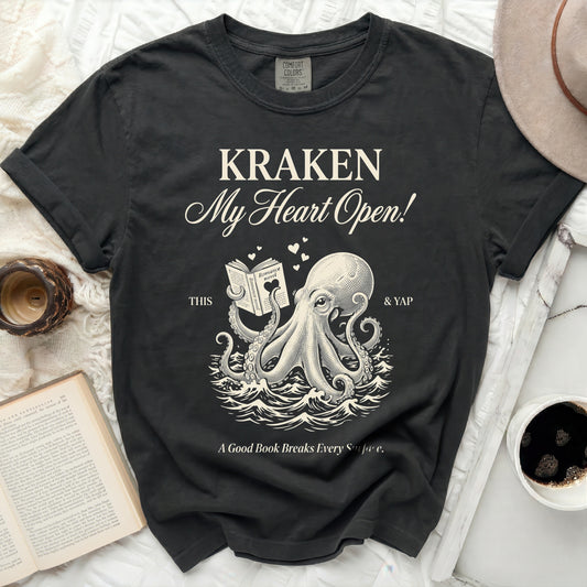 Black t-shirt with Kraken holding a romance novel and text.