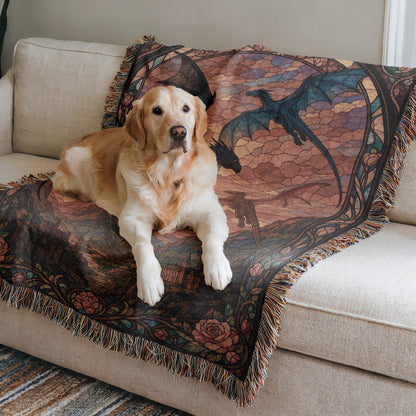 A golden retriever dog is lying on a colorful, patterned blanket on a couch.