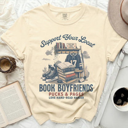 T-shirt with "Book Boyfriends" and "Pucks & Pages" text.