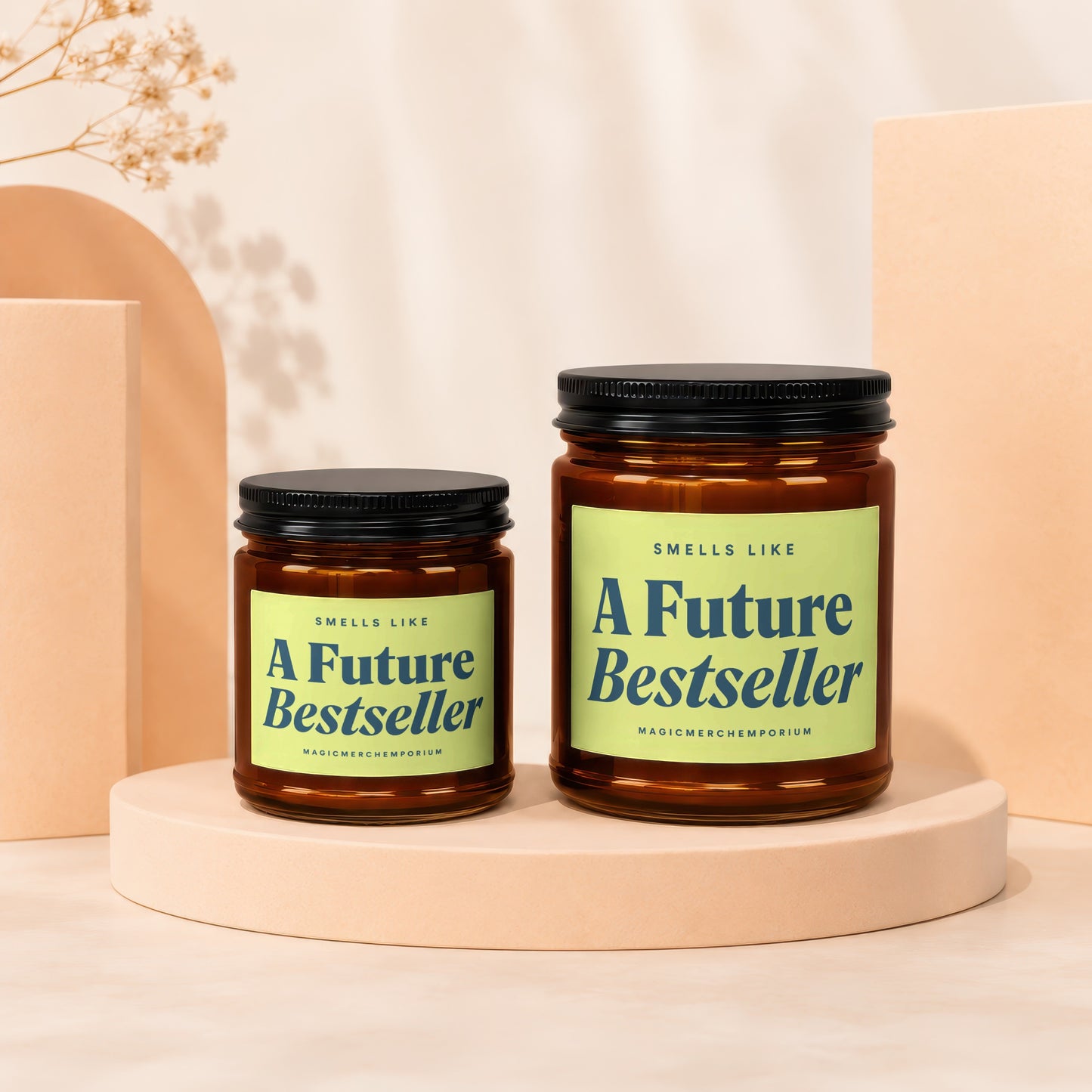 Two amber glass candles with black lids and light green labels saying "A Future Bestseller".