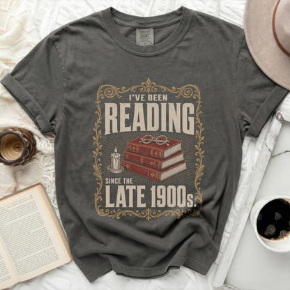 Dark grey t-shirt with "I've Been Reading Since The Late 1900s" graphic.