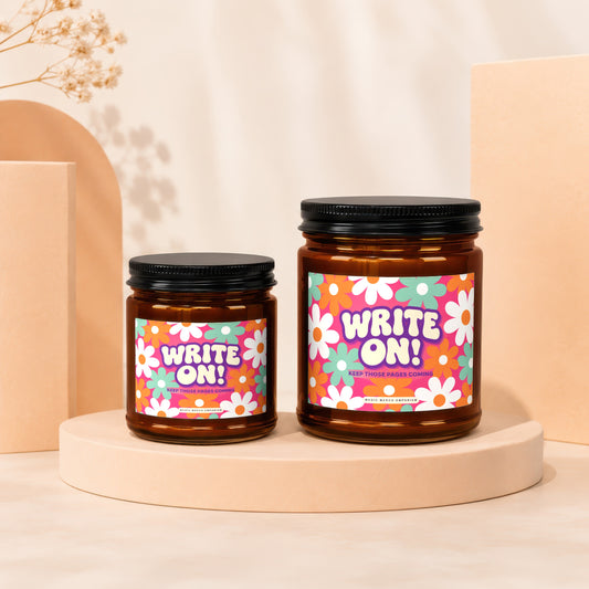 Two amber jars with floral labels saying "WRITE ON! KEEP THOSE PAGES COMING".