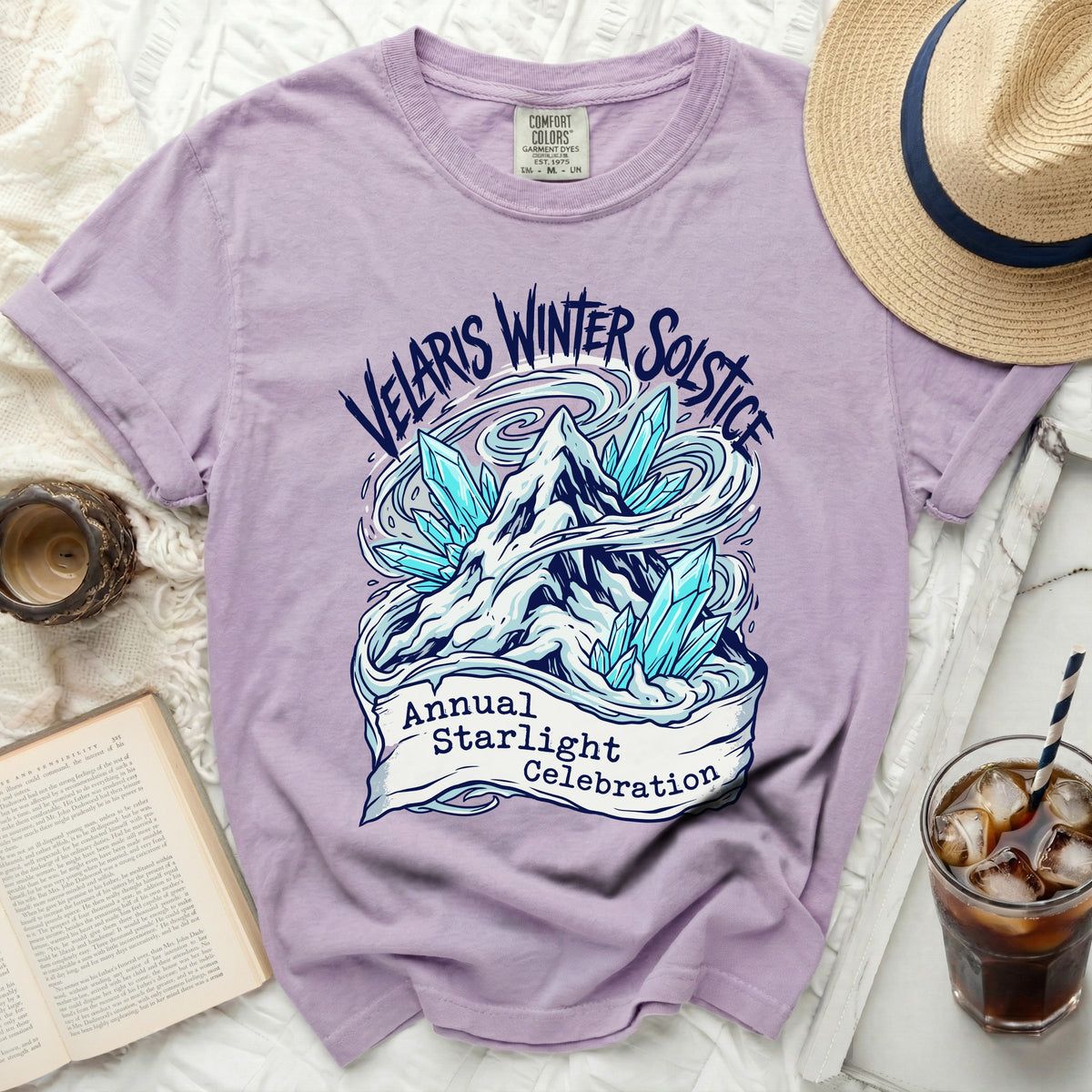 Purple t-shirt with "Velaris Winter Solstice Annual Starlight Celebration" graphic.