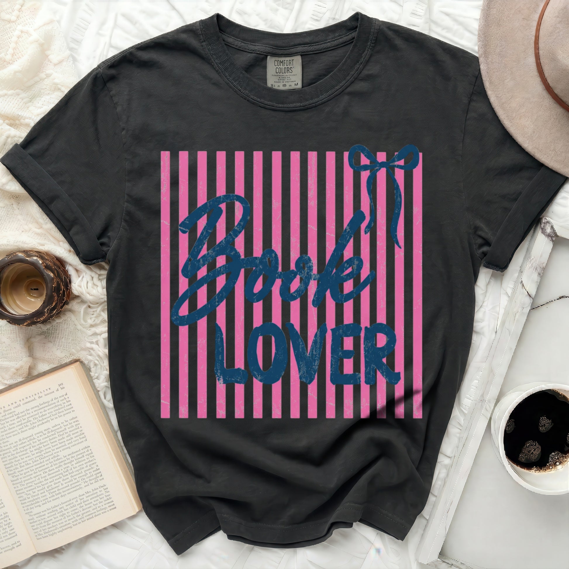 Black t-shirt with pink stripes and "Book Lover" text in blue.