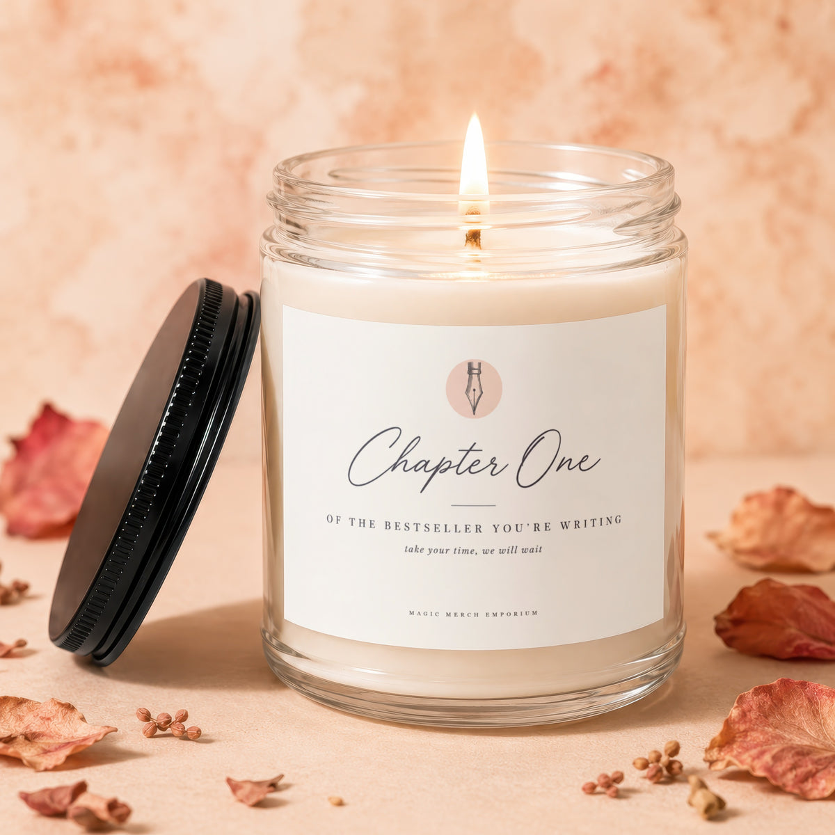Candle with lit wick labeled "Chapter One," with dried leaves scattered.