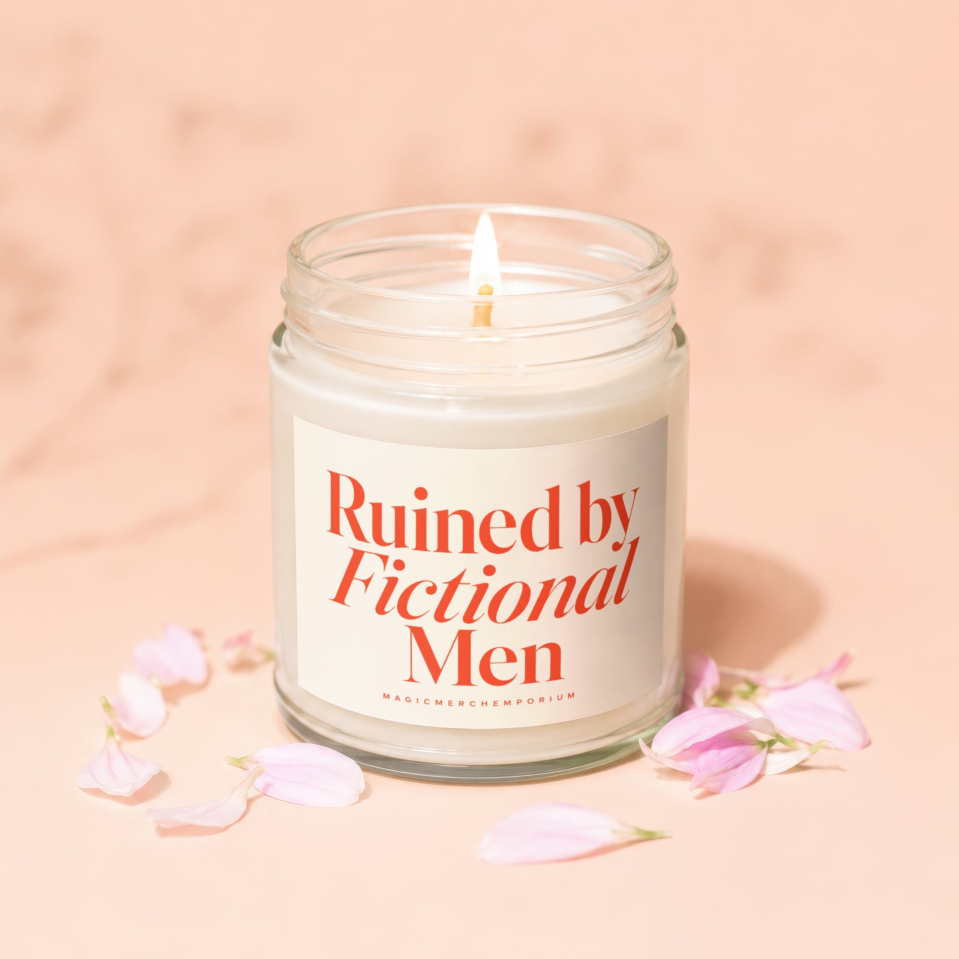 Jar candle with lit wick, featuring text "Ruined by Fictional Men".