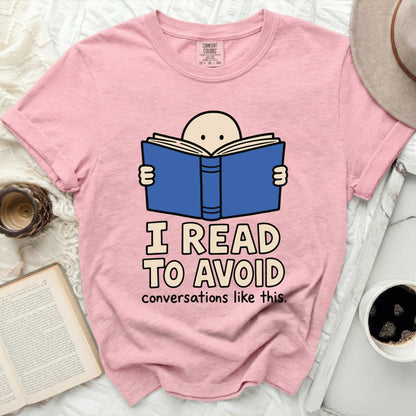 Pink t-shirt with text "I READ TO AVOID conversations like this."