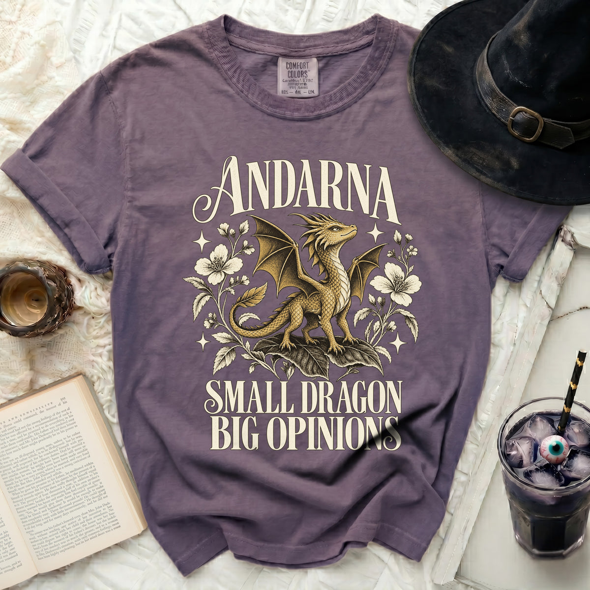 Purple t-shirt with "Andarna Small Dragon Big Opinions" text and dragon graphic.