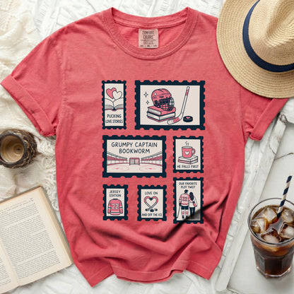 T-shirt with postage stamp designs: hockey, books, and couples.