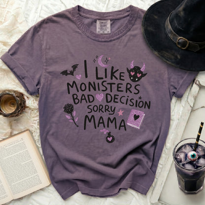 Purple t-shirt with "I like monsters, bad decision, sorry mama" text and Halloween graphics.