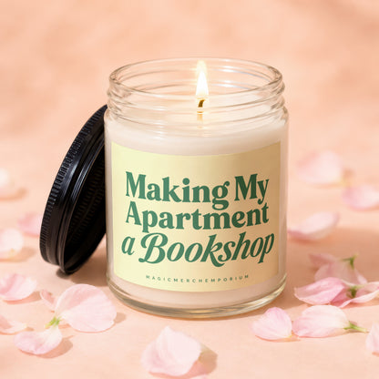 Lit candle in a glass jar with a black lid, featuring the text "Making My Apartment a Bookshop".
