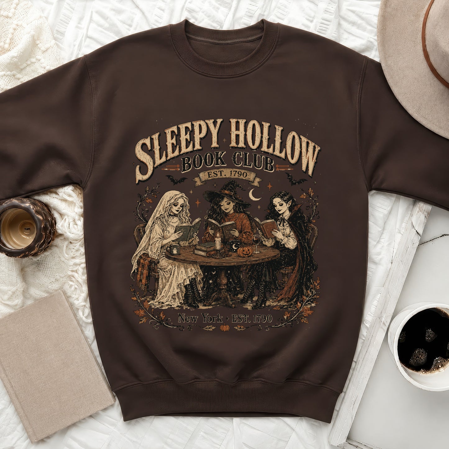 Brown sweatshirt with "Sleepy Hollow Book Club Est. 1790 New York" graphic.