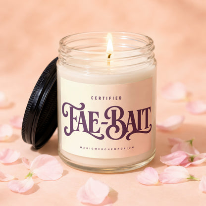 Jar candle with "Fae-Bait" text, lit flame, and pink petals.