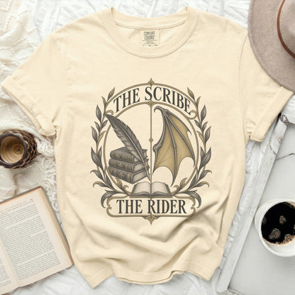 Cream t-shirt with "The Scribe The Rider" text and graphic of books, quill, and wing.